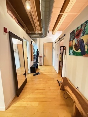 111 Beach Street, Unit 2B Boston, MA 02111 - Photo 5 of 8 a view of a room with gym equipment