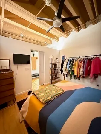a bedroom with a bed and a walk in closet