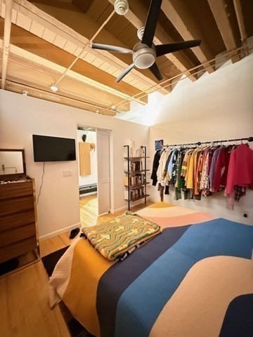 111 Beach Street, Unit 2B Boston, MA 02111 - Photo 6 of 8 a bedroom with a bed and a walk in closet