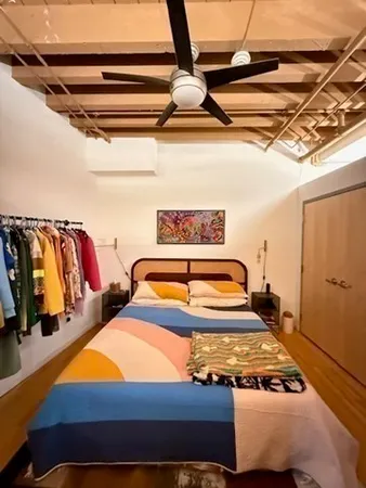 a bedroom with furniture and a walk in closet