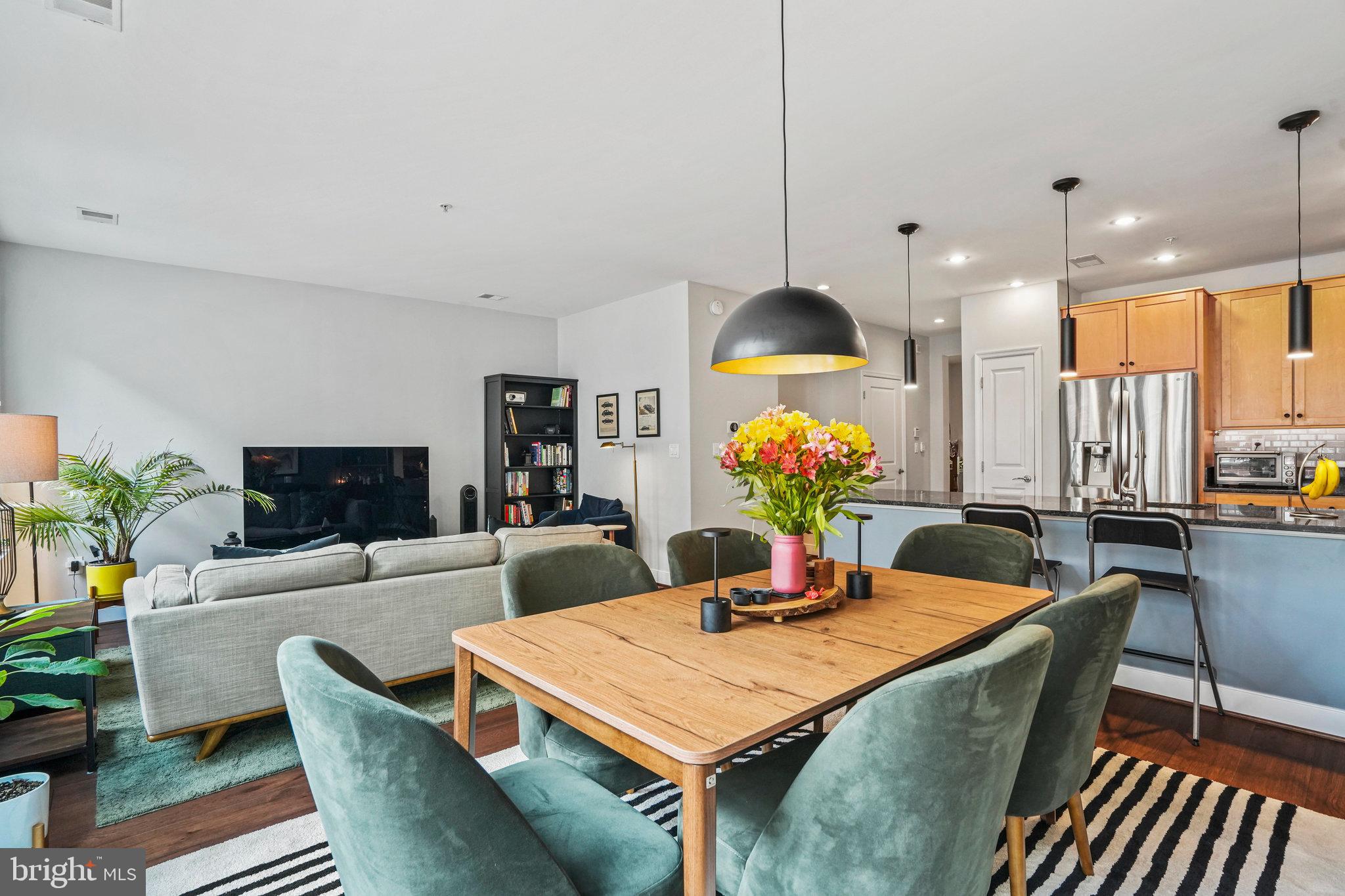 1811 14th Street North, Unit C104 Arlington, VA 22209 - Photo 11 of 44 a view of a dining room with furniture and a potted plant