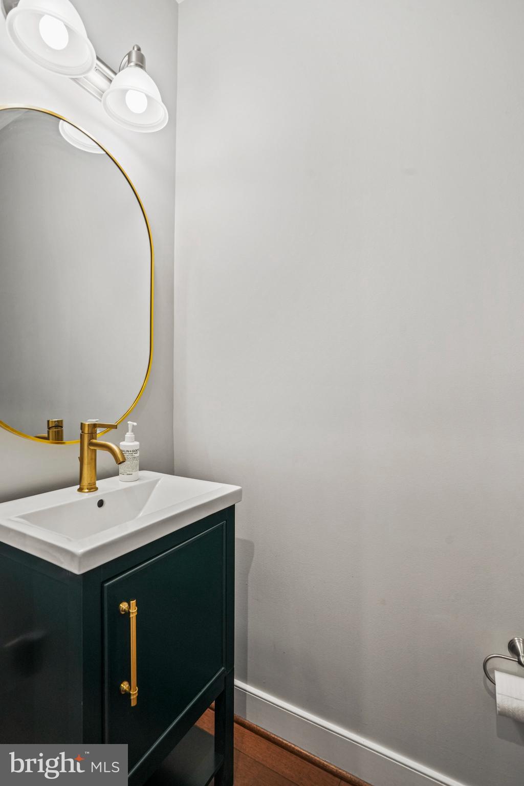 1811 14th Street North, Unit C104 Arlington, VA 22209 - Photo 18 of 44 a bathroom with a sink and a mirror