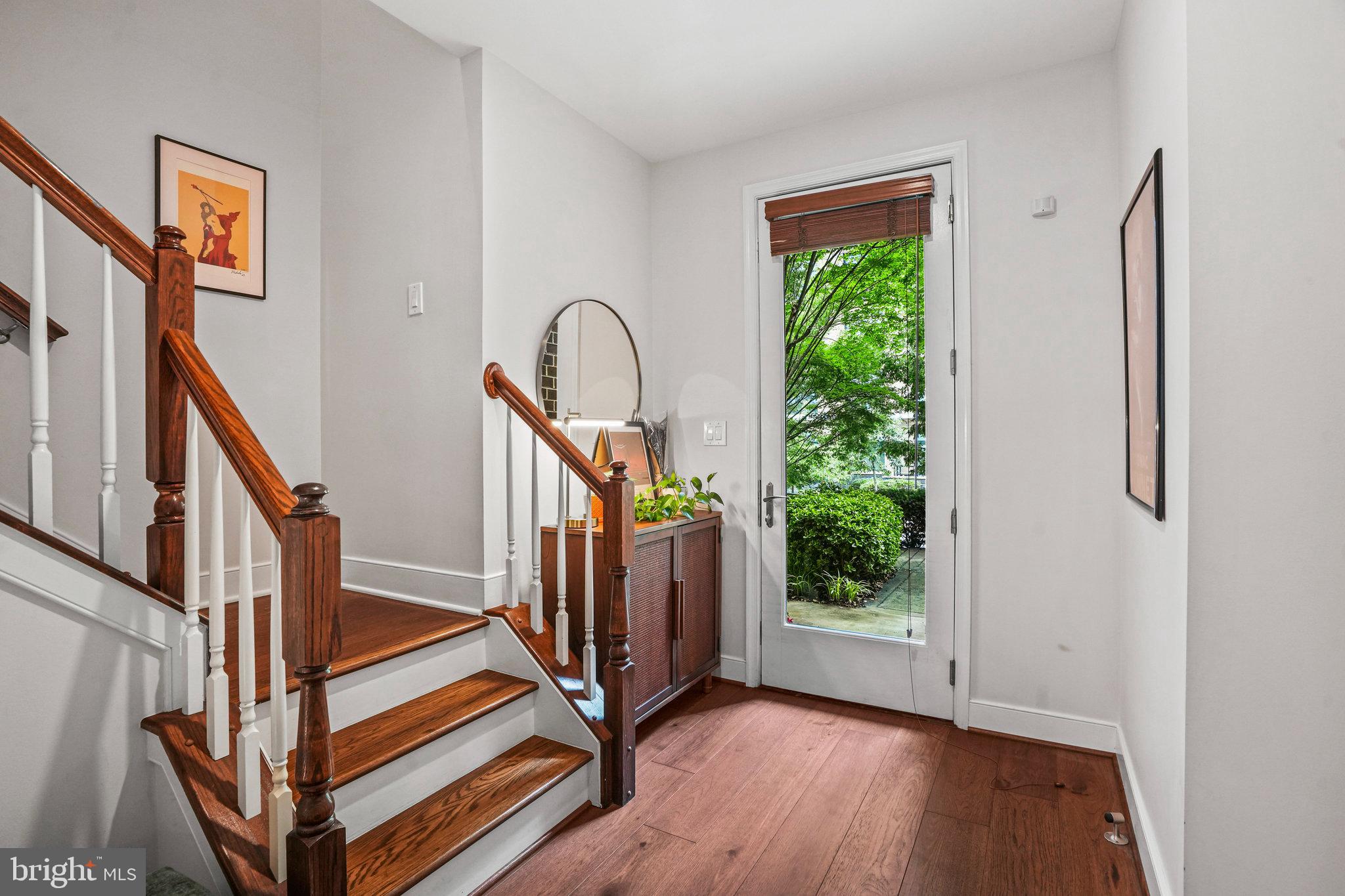 1811 14th Street North, Unit C104 Arlington, VA 22209 - Photo 2 of 44 a view of entryway with wooden floor and stairs