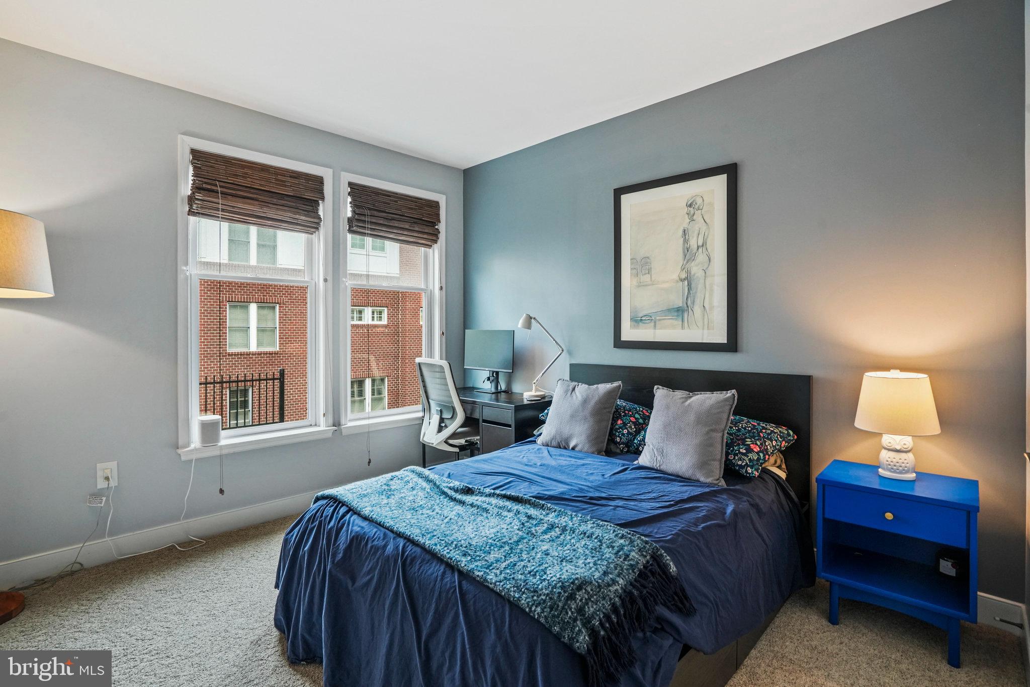 1811 14th Street North, Unit C104 Arlington, VA 22209 - Photo 26 of 44 a bedroom with a bed and a window