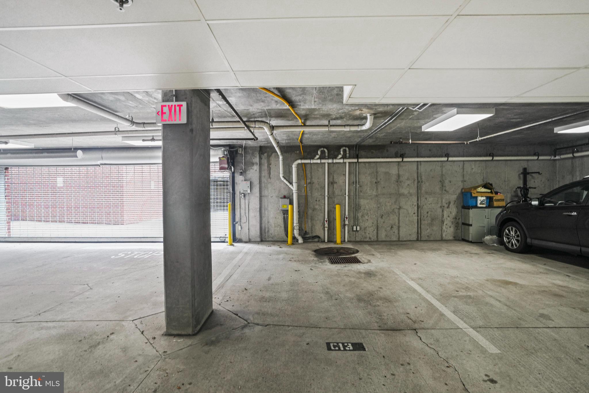1811 14th Street North, Unit C104 Arlington, VA 22209 - Photo 31 of 44 a view of parking garage with cars