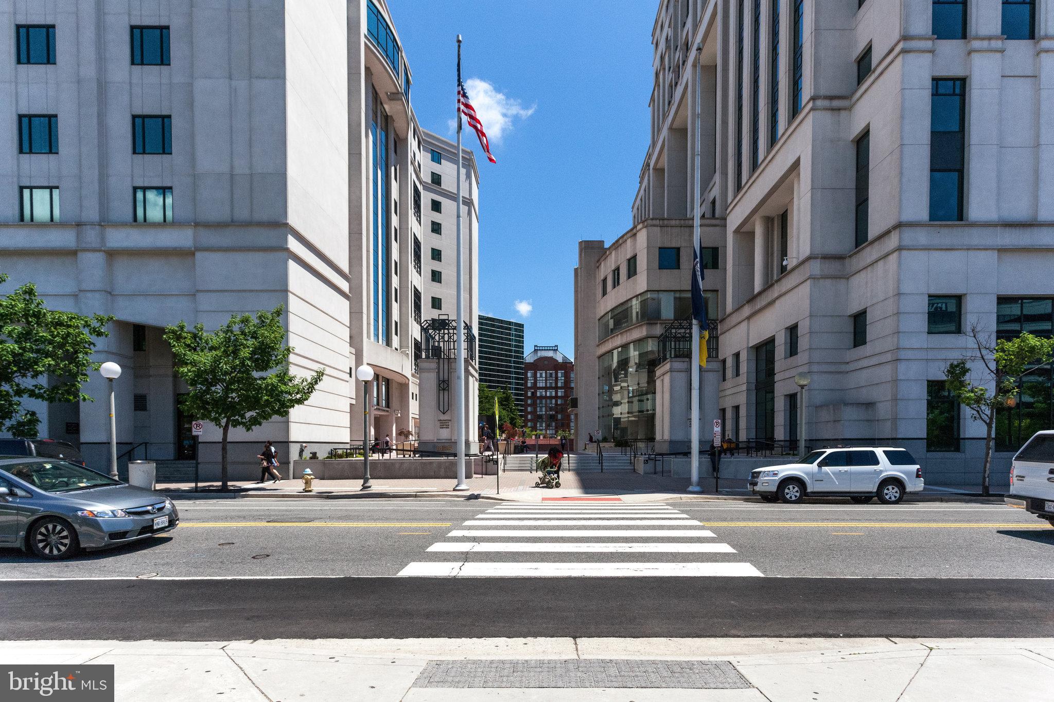 1811 14th Street North, Unit C104 Arlington, VA 22209 - Photo 40 of 44 a city street lined with buildings and cars