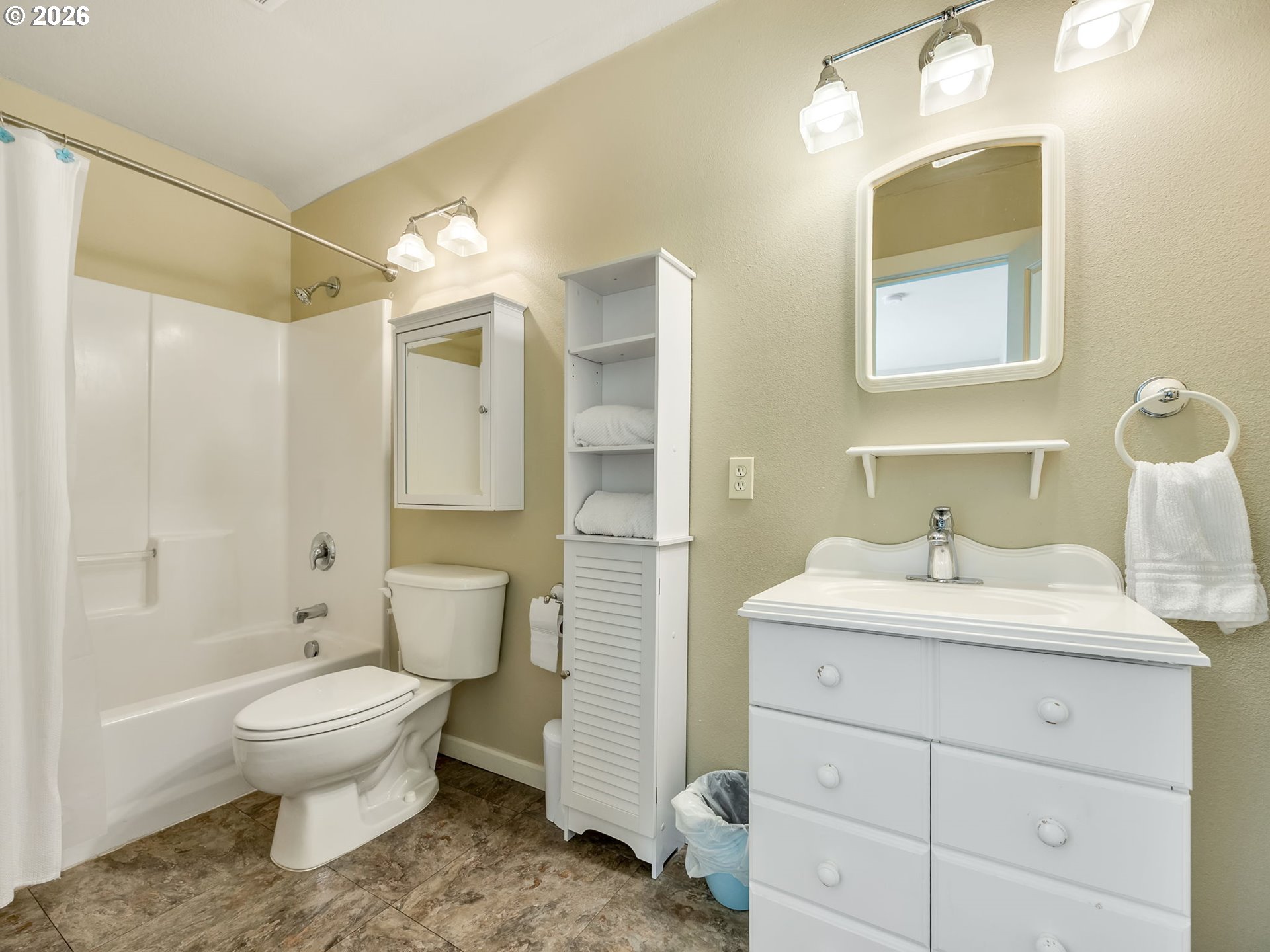 1077 Southwest Ridge Road Warrenton, OR 97146 - Photo 38 of 46 a bathroom with a toilet sink double vanity and shower