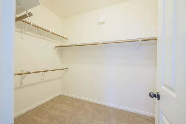 a view of an empty walk in closet