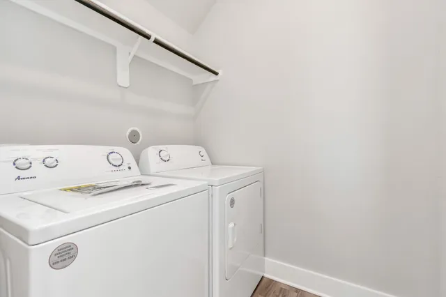 a bathroom with a double vanity sink toilet and shower