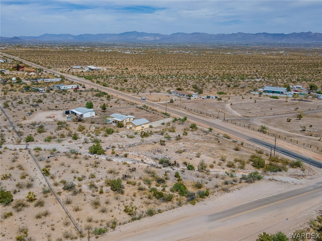 2465 Egar Road Golden Valley, AZ 86413 - Photo 94 of 98 The property is situated in a desert landscape, featuring a main road and smaller unpaved roads