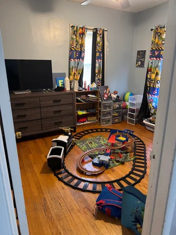 a room with furniture and flat screen tv