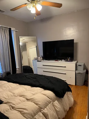 a bedroom with a bed and television