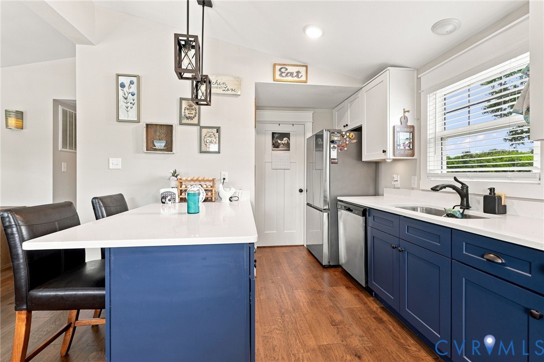 1108 Schroeder Road Powhatan, VA 23139 - Photo 21 of 33 Kitchen featuring wood-finish flooring, white coun