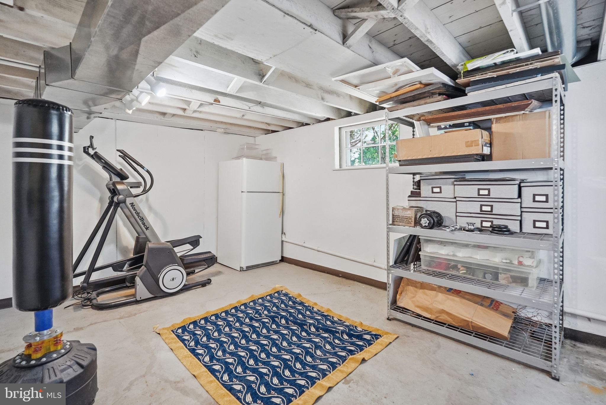 6814 Brookville Road Chevy Chase, MD 20815 - Photo 33 of 39 Versatile basement space for fitness and storage.