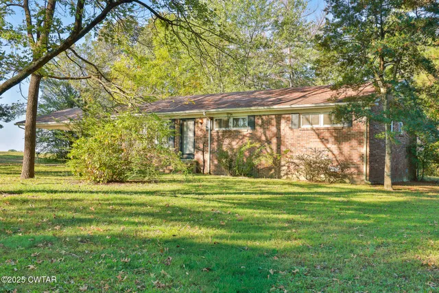 a big room with trees in the background