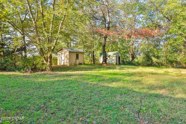 a house view with swimming pool