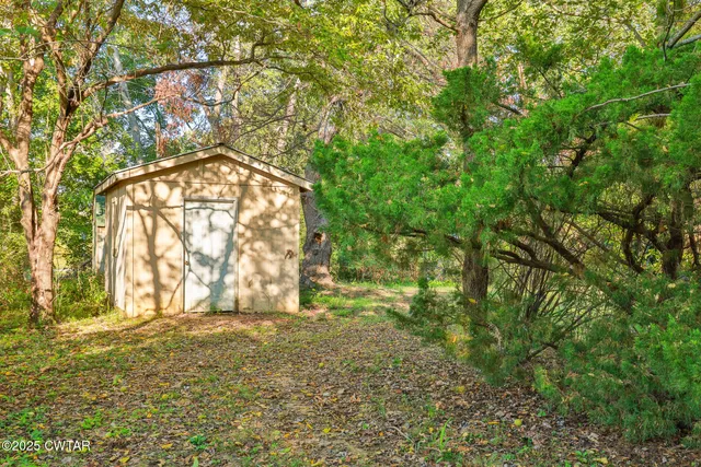a view of yard from a room