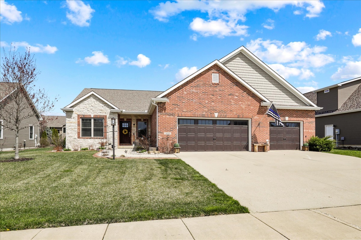 1604 Kassen Avenue Mahomet, IL 61853 - Photo 1 of 35 a front view of a house with a yard