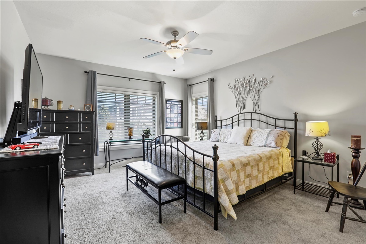 1604 Kassen Avenue Mahomet, IL 61853 - Photo 12 of 35 a bedroom with a bed and a chandelier