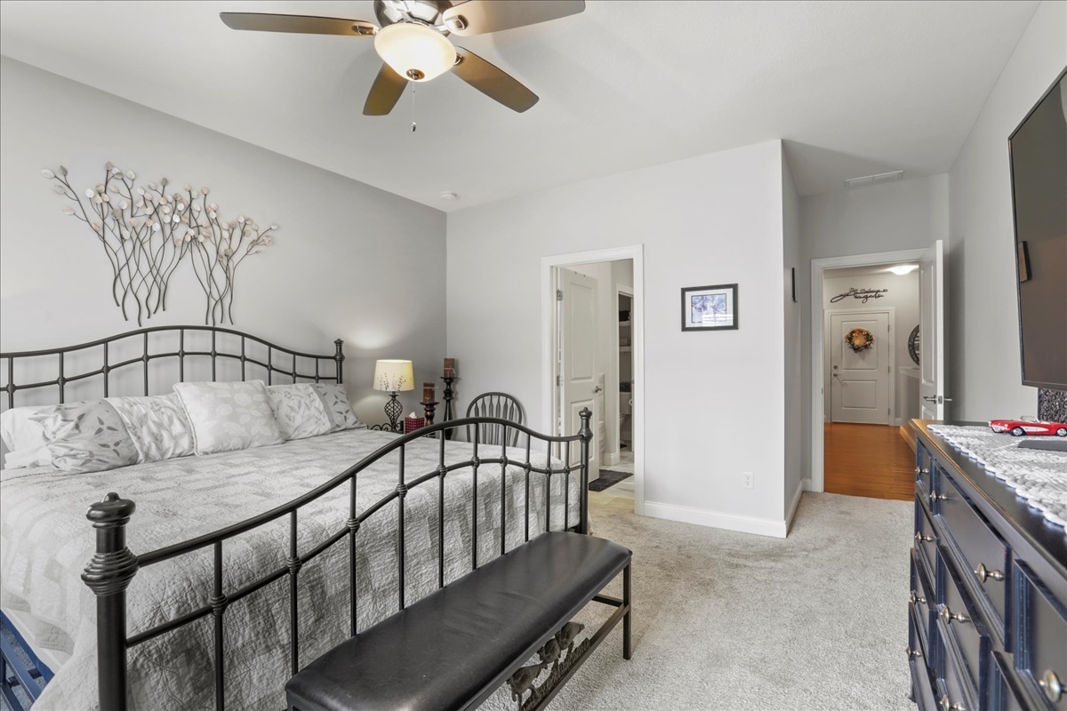 1604 Kassen Avenue Mahomet, IL 61853 - Photo 13 of 35 a bedroom with a bed and a chandelier