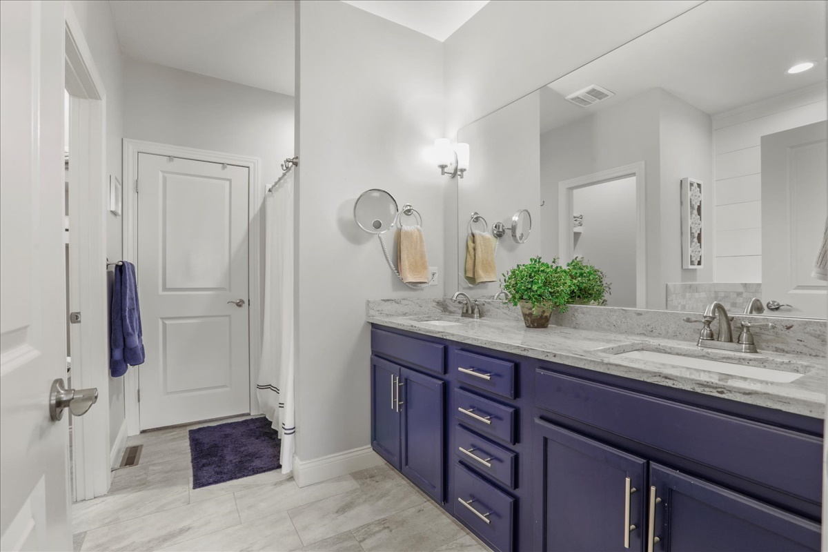 1604 Kassen Avenue Mahomet, IL 61853 - Photo 14 of 35 a spacious bathroom with a granite countertop sink and a mirror