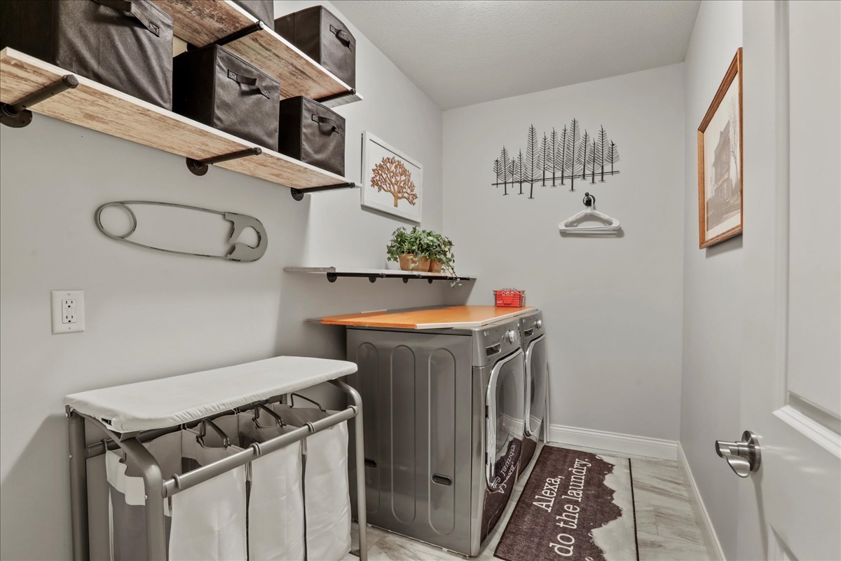 1604 Kassen Avenue Mahomet, IL 61853 - Photo 17 of 35 a utility room with a sink a washer and dryer