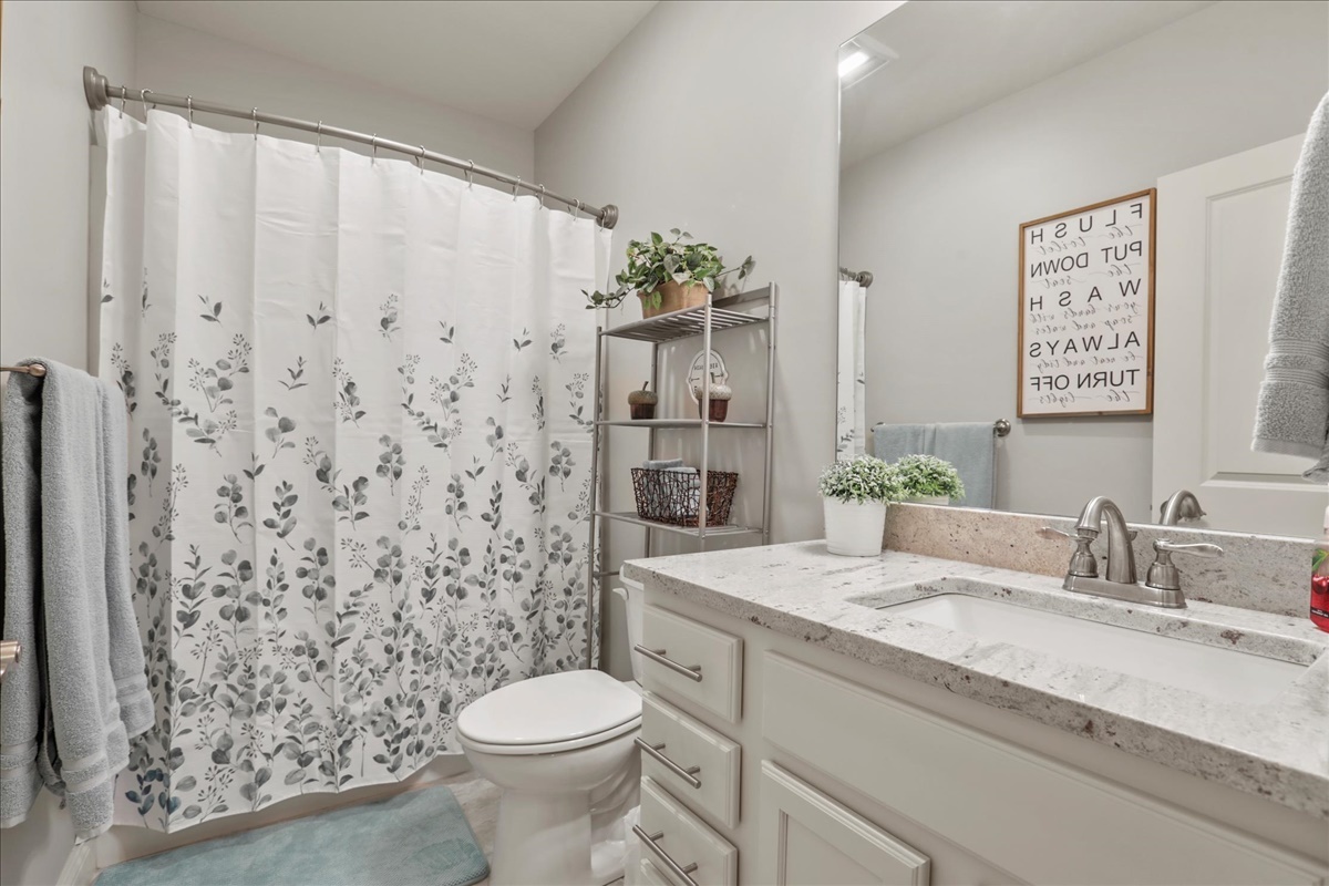 1604 Kassen Avenue Mahomet, IL 61853 - Photo 26 of 35 a bathroom with a granite countertop sink toilet and shower