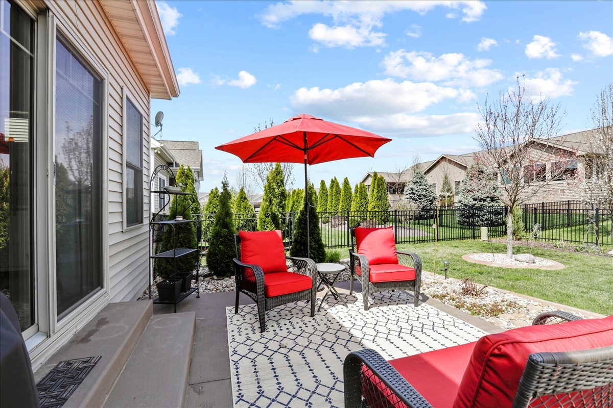 1604 Kassen Avenue Mahomet, IL 61853 - Photo 31 of 35 a view of a patio with table and chairs under an umbrella