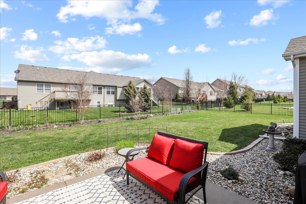 1604 Kassen Avenue Mahomet, IL 61853 - Photo 32 of 35 a view of a big yard with a table and a fire pit