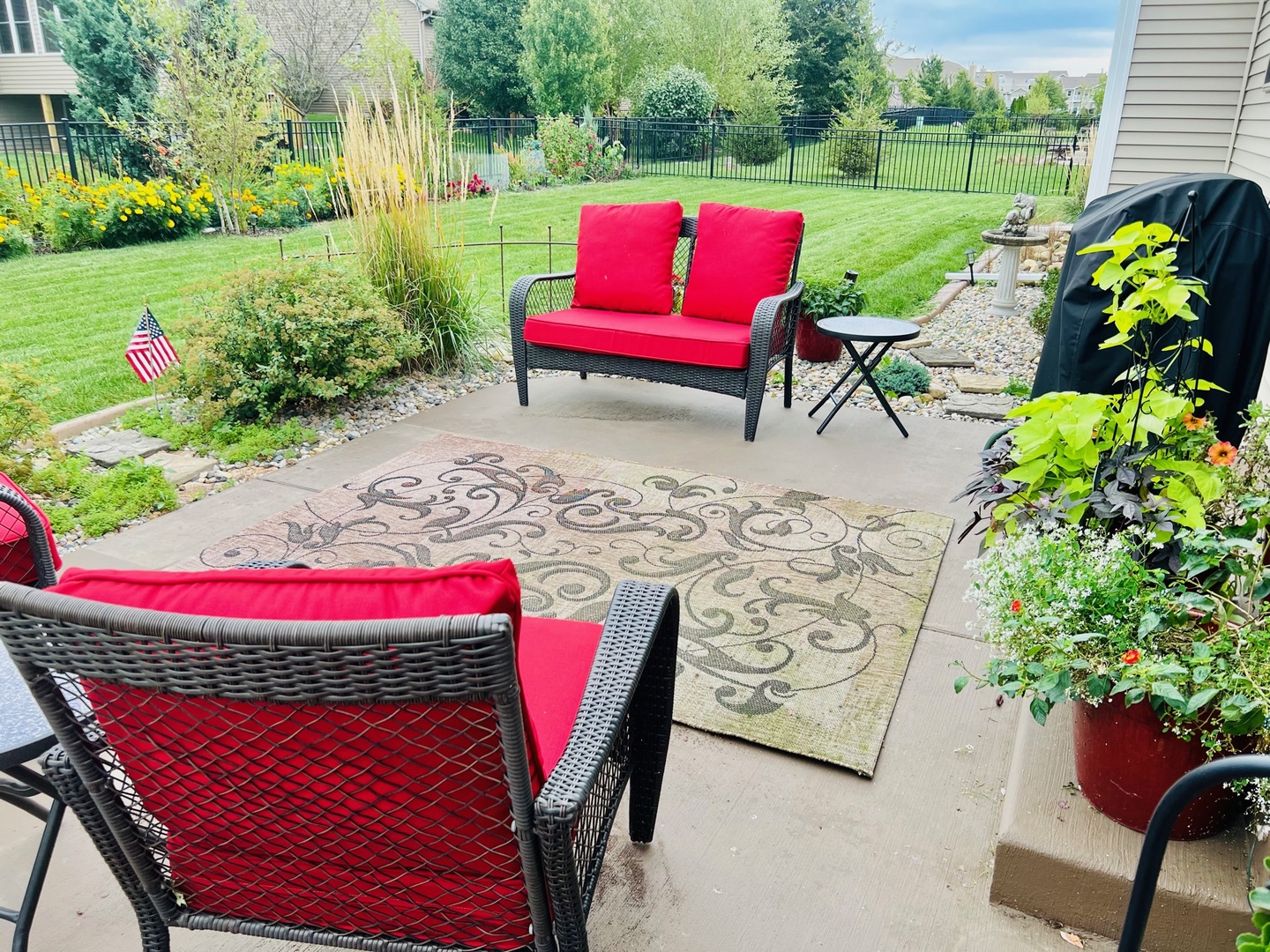 1604 Kassen Avenue Mahomet, IL 61853 - Photo 33 of 35 a view of a yard with furniture and a garden