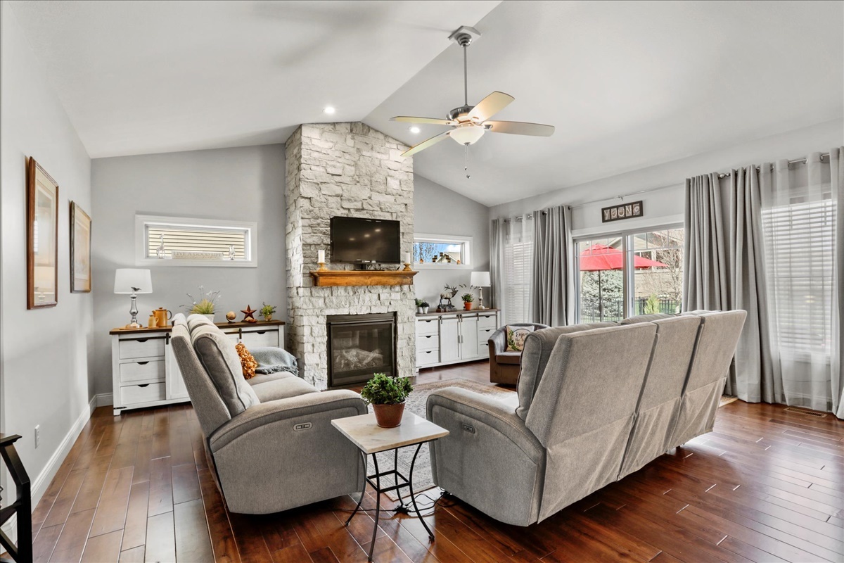 1604 Kassen Avenue Mahomet, IL 61853 - Photo 6 of 35 a living room with furniture a fireplace and a flat screen tv