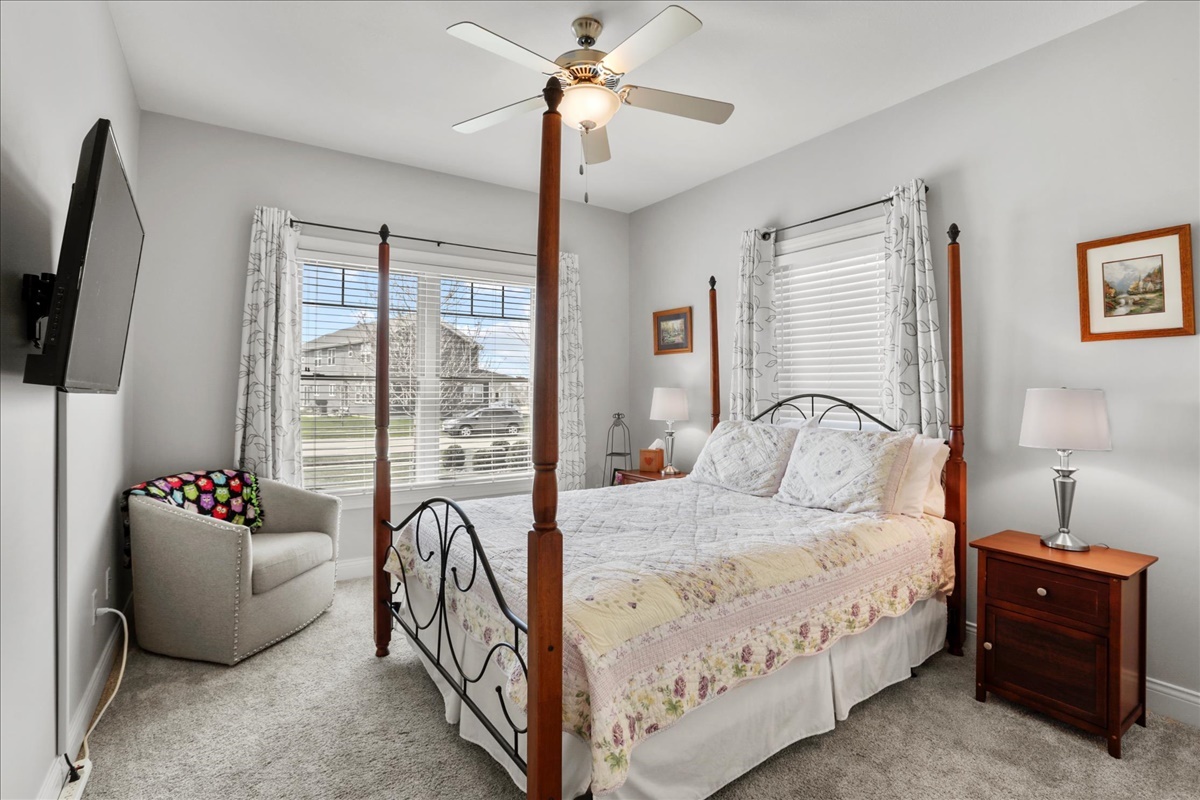 1604 Kassen Avenue Mahomet, IL 61853 - Photo 10 of 35 a bedroom with a bed and a flat tv screen