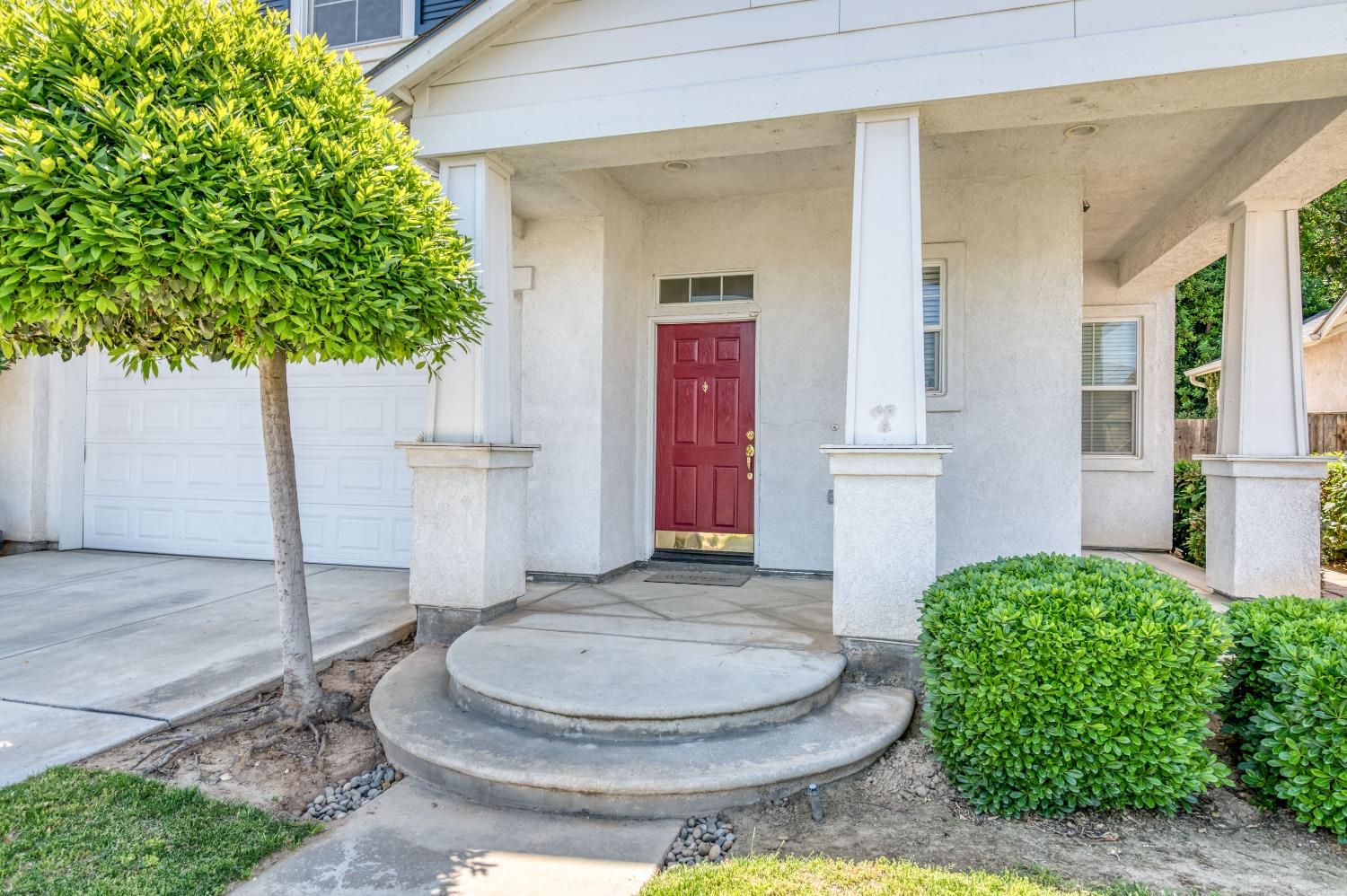 694 West Lisbon Lane Clovis, CA 93619 - Photo 2 of 39 a bathroom with a sink and a mirror
