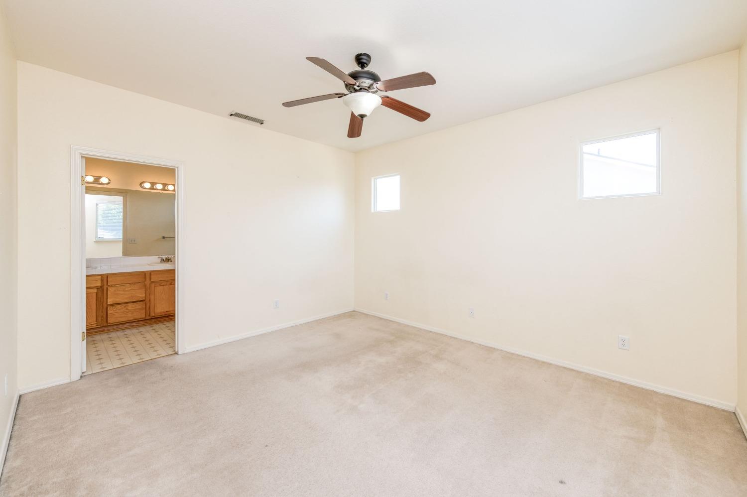 694 West Lisbon Lane Clovis, CA 93619 - Photo 21 of 39 a view of empty room with wooden floor