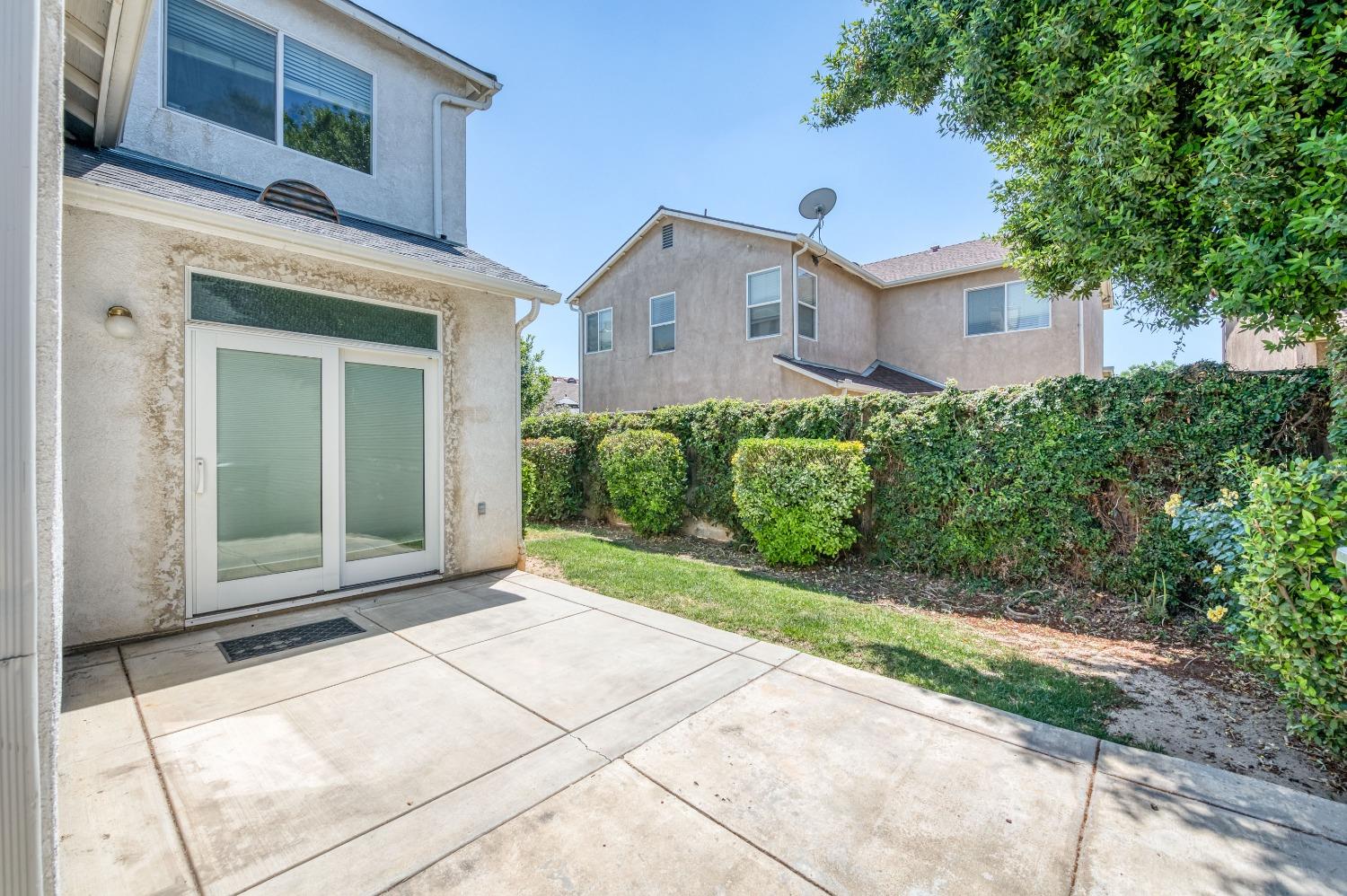 694 West Lisbon Lane Clovis, CA 93619 - Photo 27 of 39 a view of a house with a yard