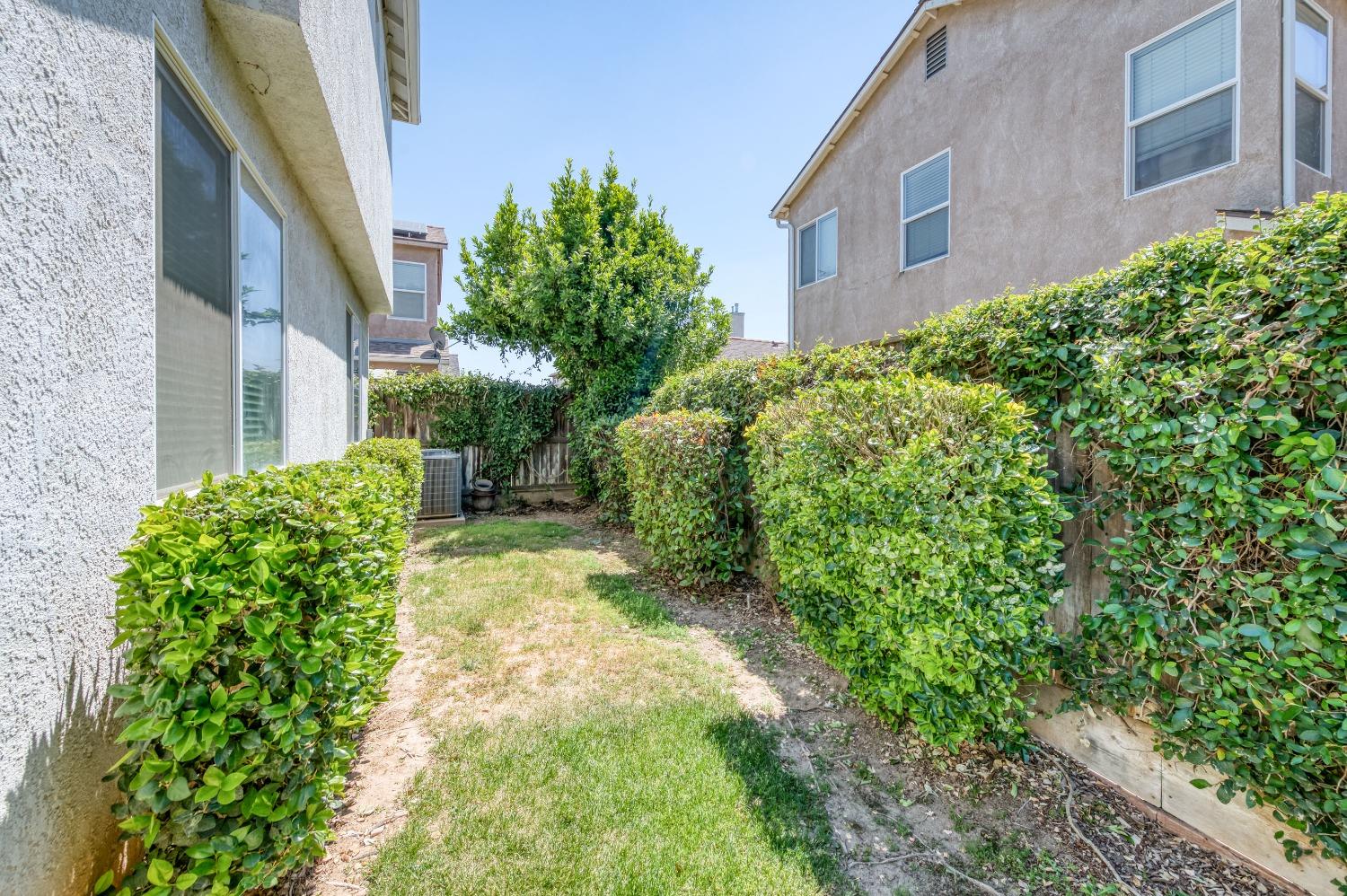 694 West Lisbon Lane Clovis, CA 93619 - Photo 29 of 39 a view of yard with pathway