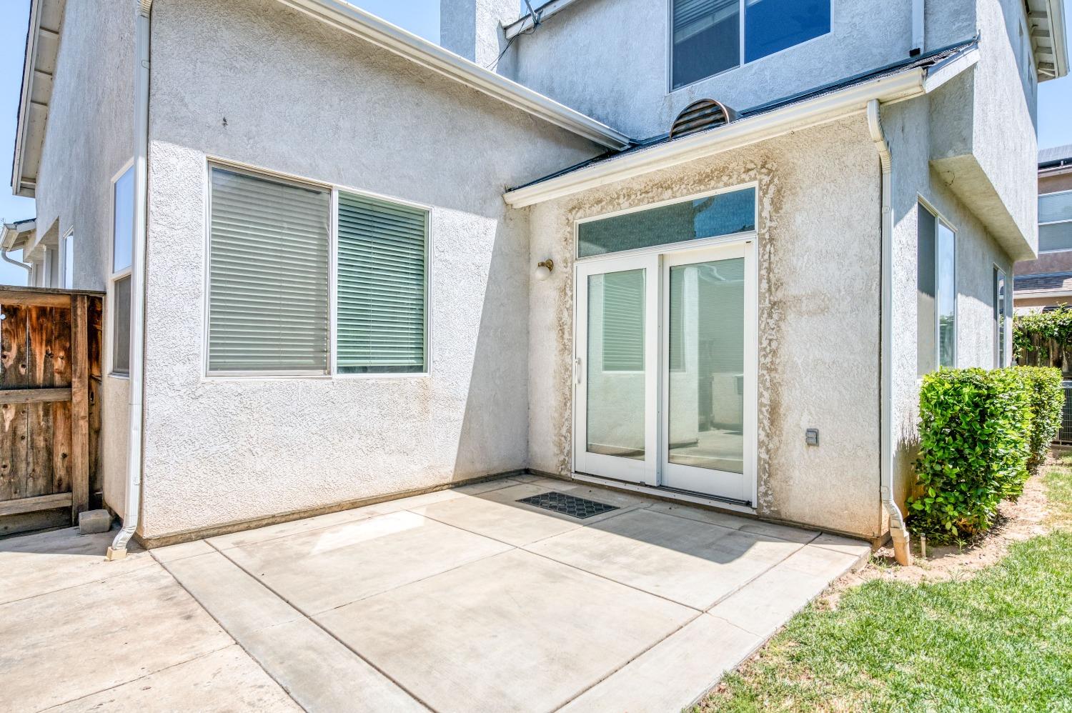 694 West Lisbon Lane Clovis, CA 93619 - Photo 32 of 39 a view of a house with a door