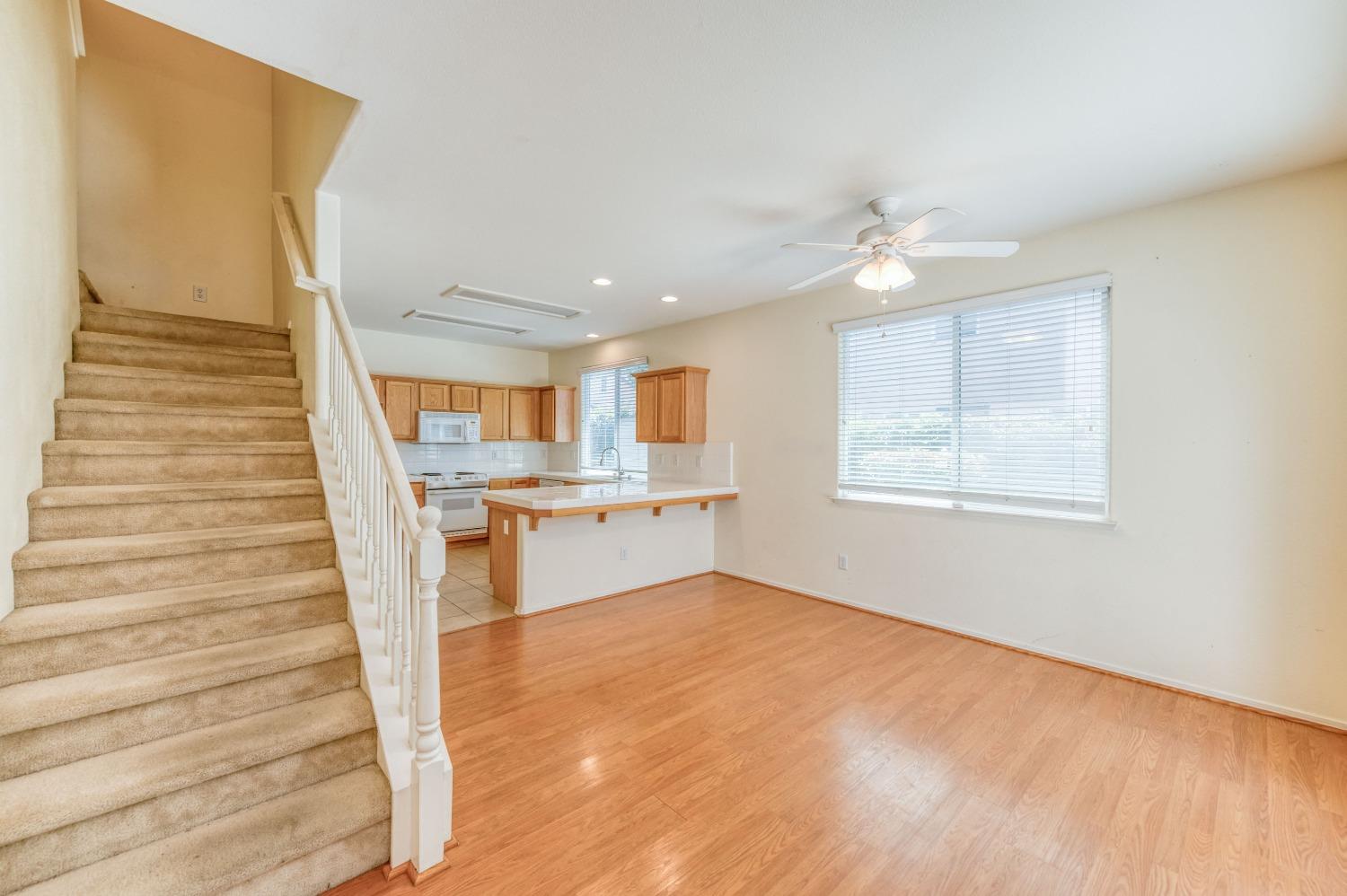 694 West Lisbon Lane Clovis, CA 93619 - Photo 8 of 39 a view of a kitchen with kitchen and wooden floor