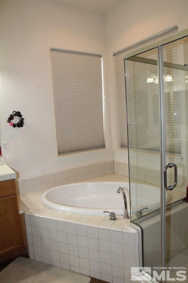 2550 Perryville Drive Reno, NV 89521 - Photo 11 of 30 a bathroom with a tub and a shower