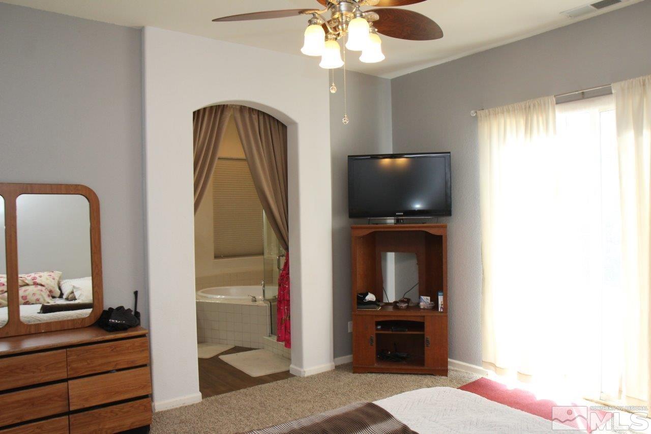 2550 Perryville Drive Reno, NV 89521 - Photo 8 of 30 a living room with furniture and a flat screen tv