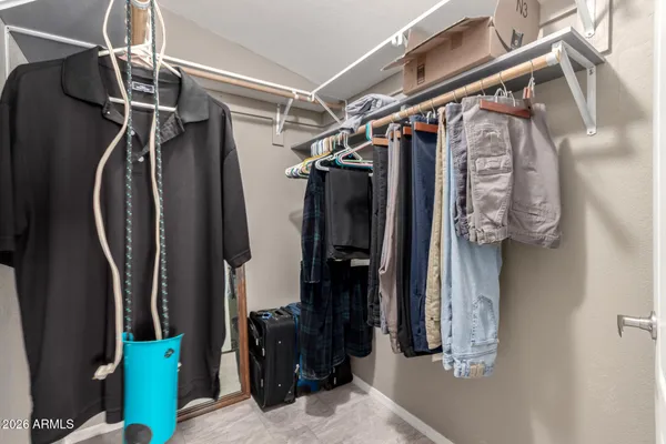 a bedroom with a bed table and window