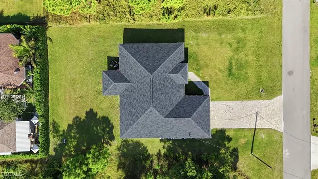 an aerial view of a house with a garden
