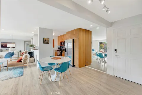 a kitchen that has a sink and a stove top oven