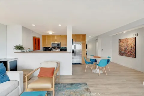 a view of a kitchen with a sink and living room