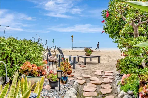 a view of a chairs and table in a backyard