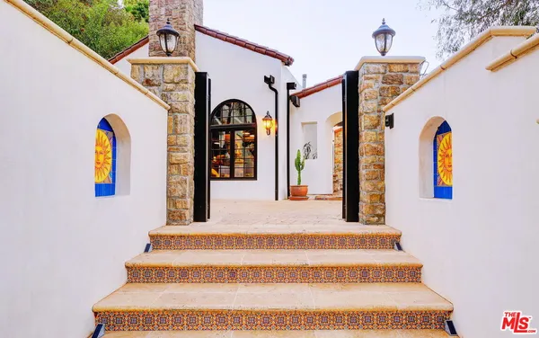 a front view of a house with garden