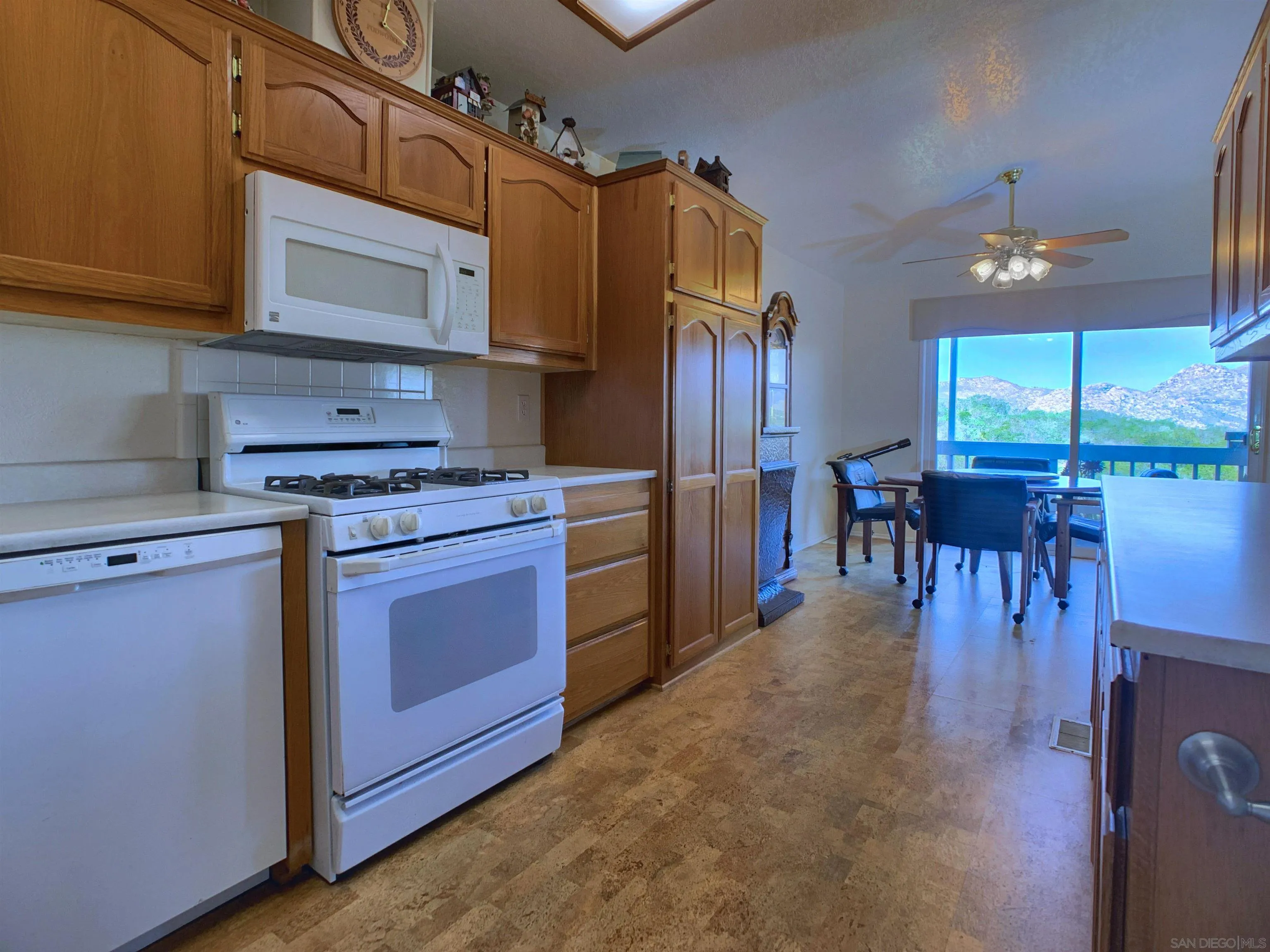 9500 Harritt Road, Unit SPC 25 Lakeside, CA 92040 - Photo 11 of 43 a kitchen with stainless steel appliances granite countertop a stove cabinets and a refrigerator