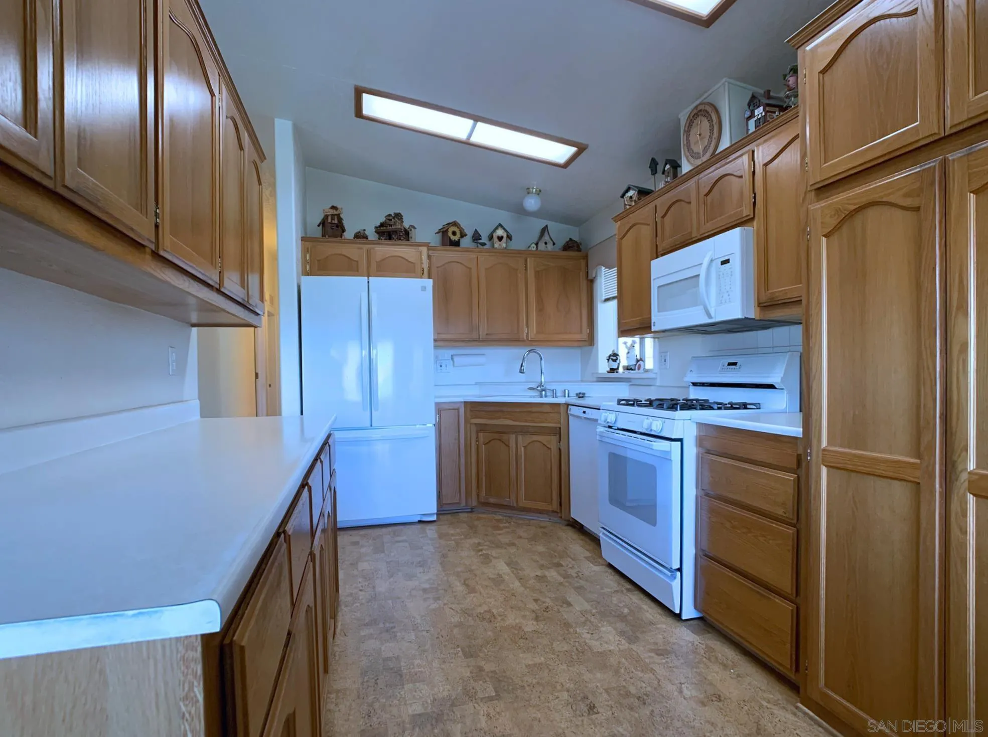 9500 Harritt Road, Unit SPC 25 Lakeside, CA 92040 - Photo 13 of 43 a kitchen with stainless steel appliances granite countertop cabinets and a refrigerator