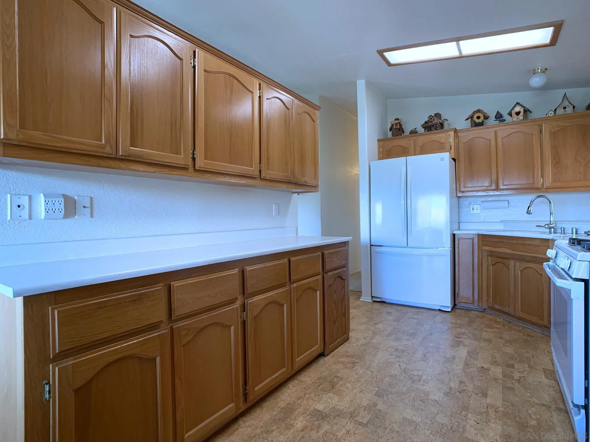 9500 Harritt Road, Unit SPC 25 Lakeside, CA 92040 - Photo 14 of 43 a kitchen with granite countertop cabinets and window