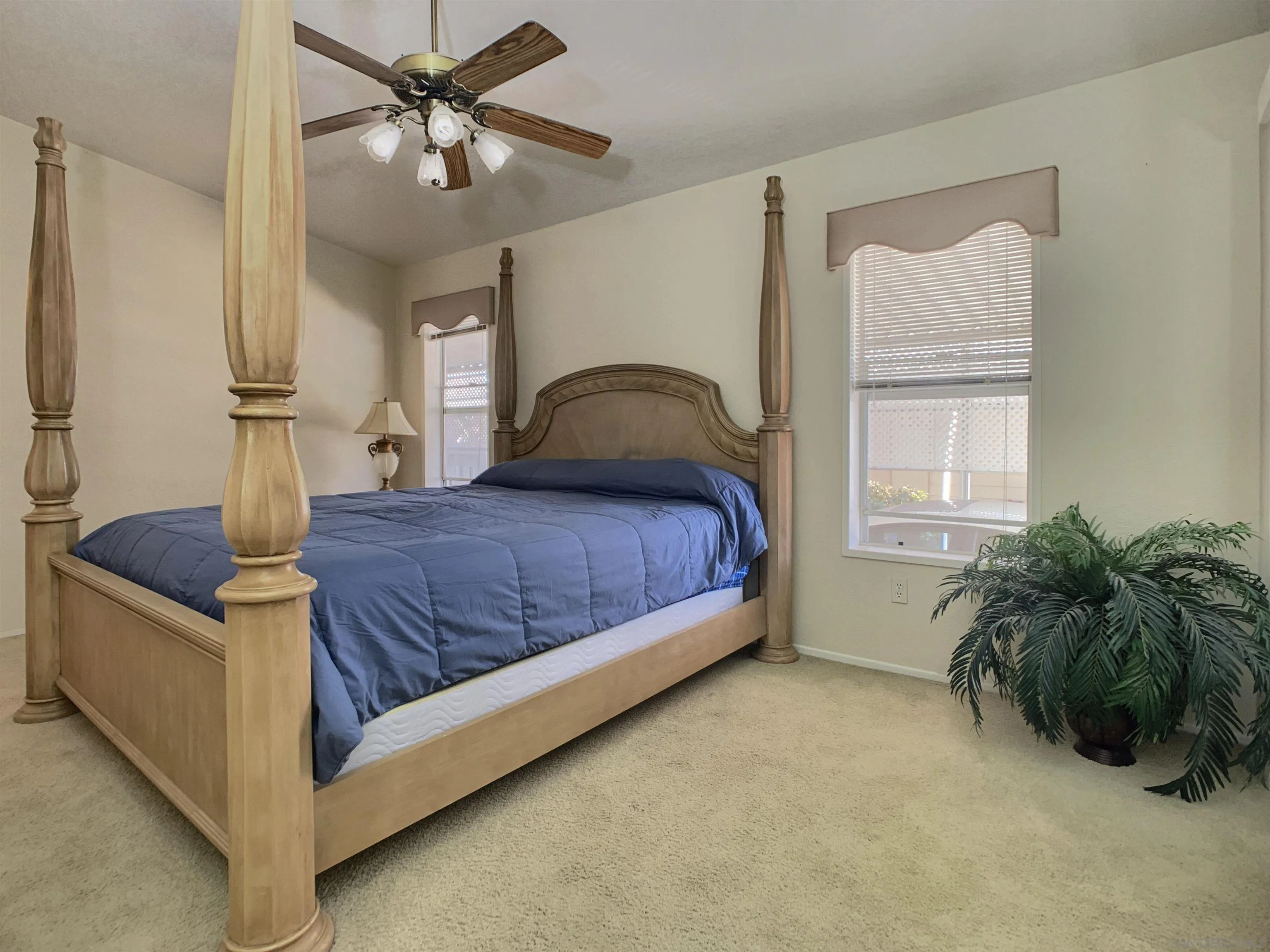 9500 Harritt Road, Unit SPC 25 Lakeside, CA 92040 - Photo 20 of 43 a living room with a bed furniture and a window